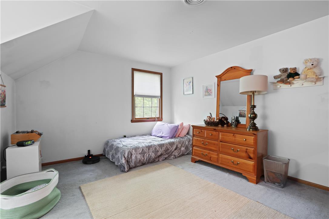209 Remington Road East Stroudsburg, PA 18301 - Photo 29 of 41 A well-lit bedroom features ample natural light from a double-hung window, offering a peaceful retreat.
