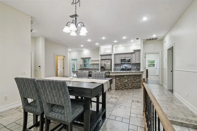 a view of a livingroom with furniture and a flat screen tv