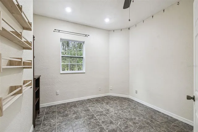 a view of a park with large trees