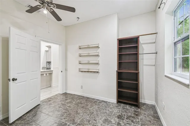 a view of a field with trees in the background