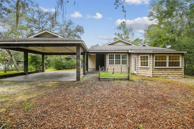 a kitchen with stainless steel appliances kitchen island granite countertop a sink and cabinets