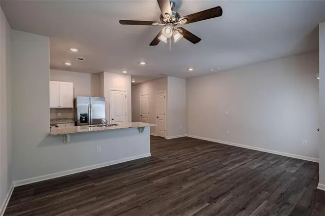 a view of kitchen with sink microwave and stove