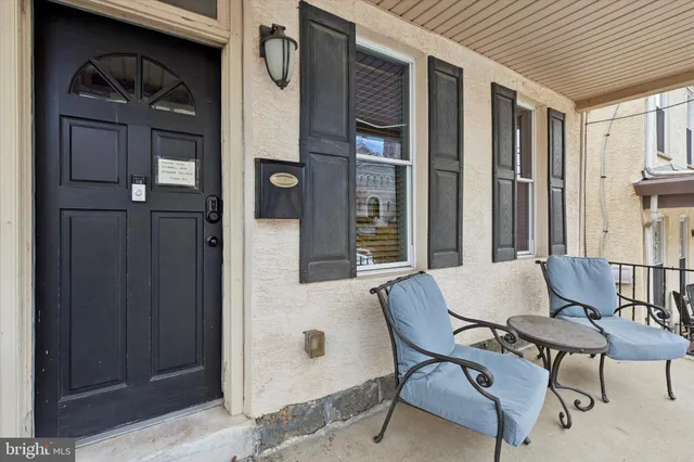 a outdoor space with patio furniture and windows