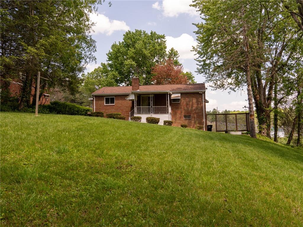 128 Clover Drive Monaca, PA 15061 - Photo 16 of 19 a front view of house with yard and green space