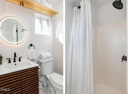 a bathroom with a bathtub and a toilet
