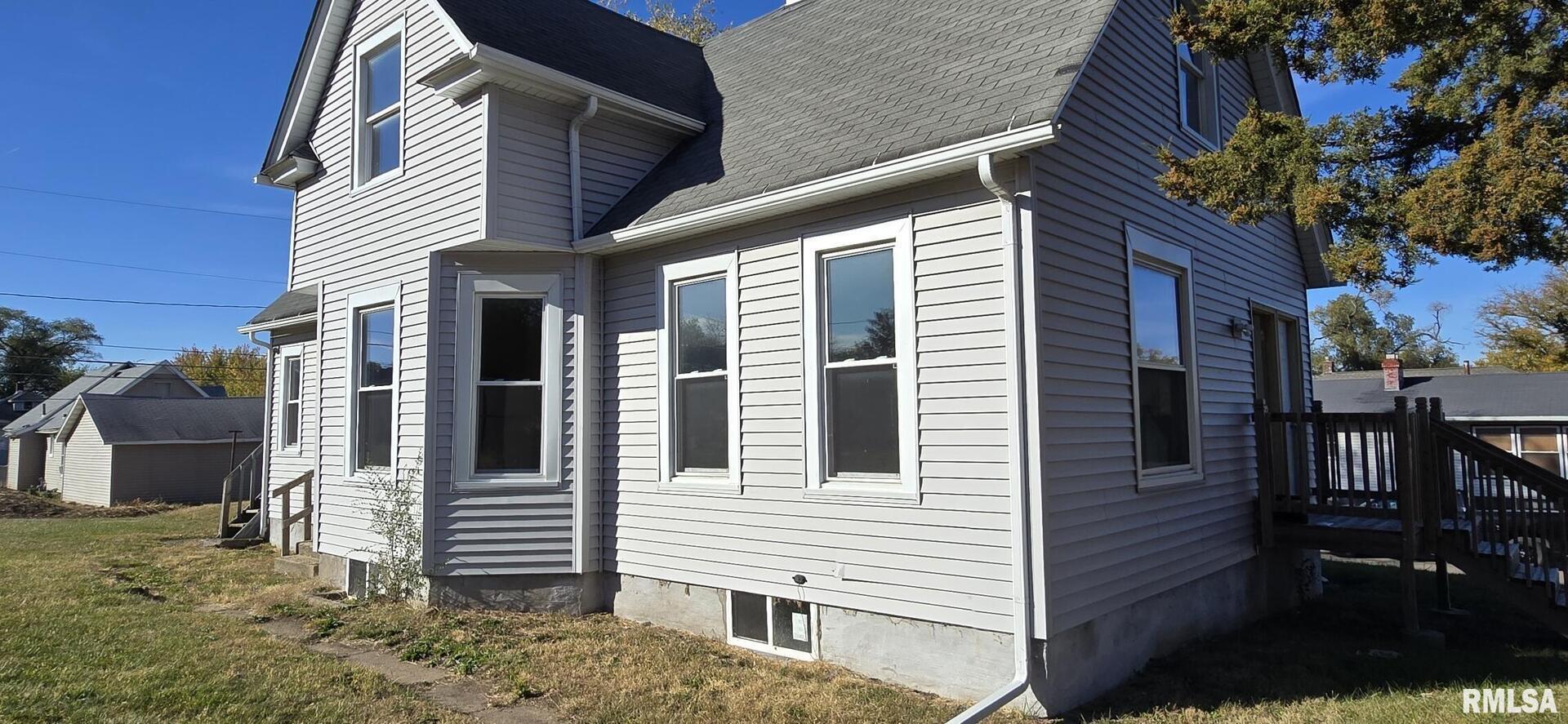 1600 9th Street Rock Island, IL 61201 - Photo 2 of 3 a view of a house with a yard and sitting space