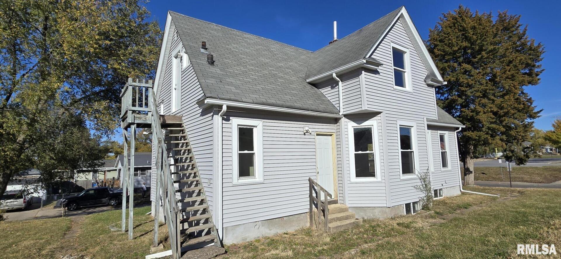 1600 9th Street Rock Island, IL 61201 - Photo 3 of 3 a view of a house with a yard