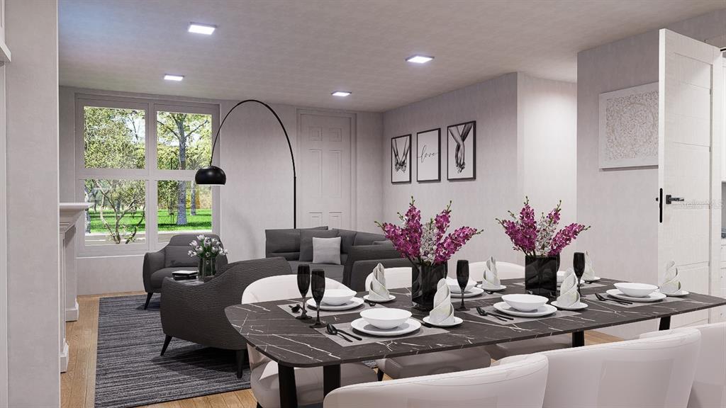 2406 Arcadia Road Holiday, FL 34690 - Photo 3 of 8 a dining room with furniture and potted plants