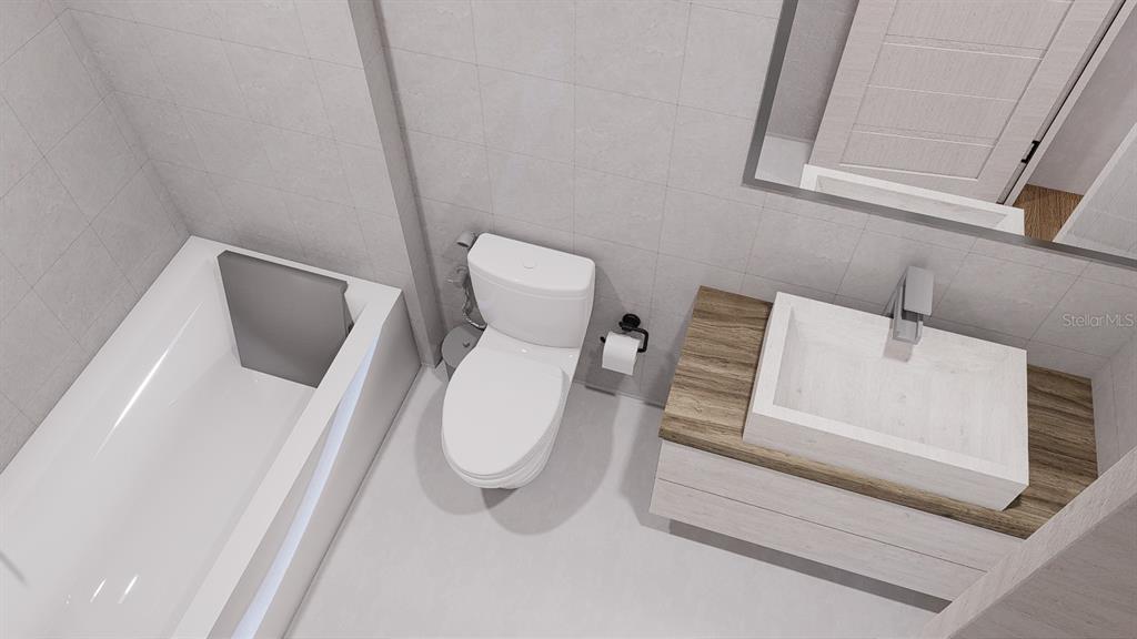 2406 Arcadia Road Holiday, FL 34690 - Photo 7 of 8 a white toilet sitting next to a white sink