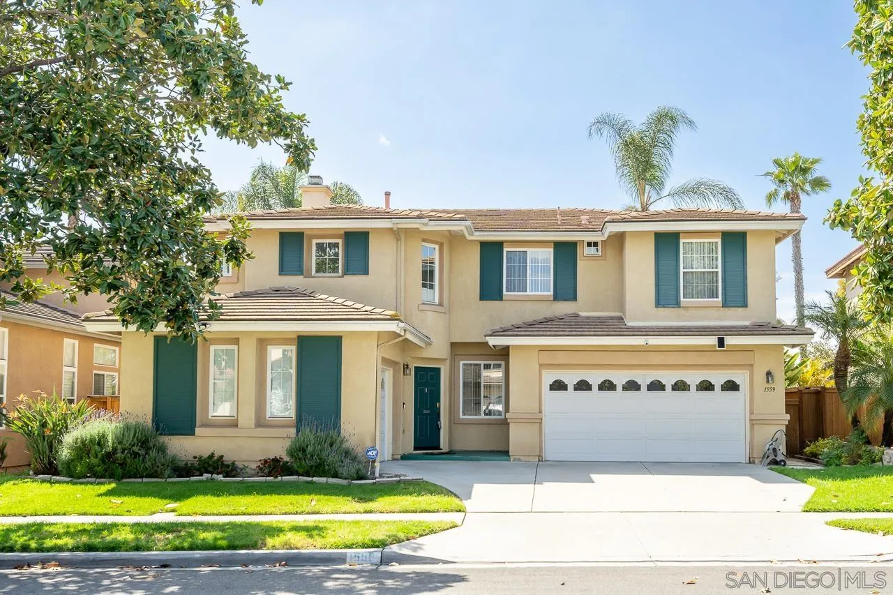 1559 Pleasanton Road Chula Vista, CA 91913 - Photo 1 of 41 a front view of a house with a yard