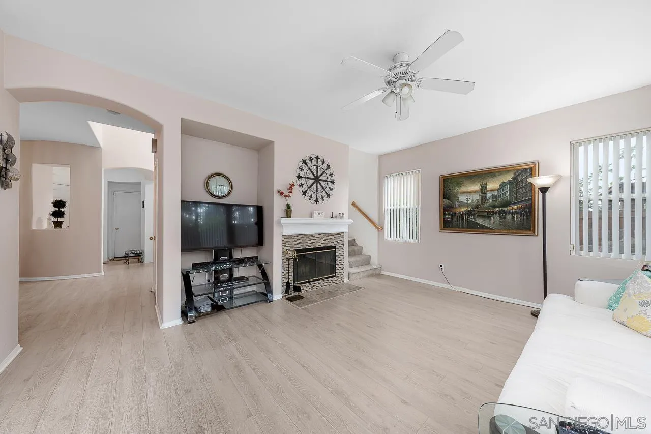 1559 Pleasanton Road Chula Vista, CA 91913 - Photo 12 of 41 a living room with furniture a fireplace and a flat screen tv