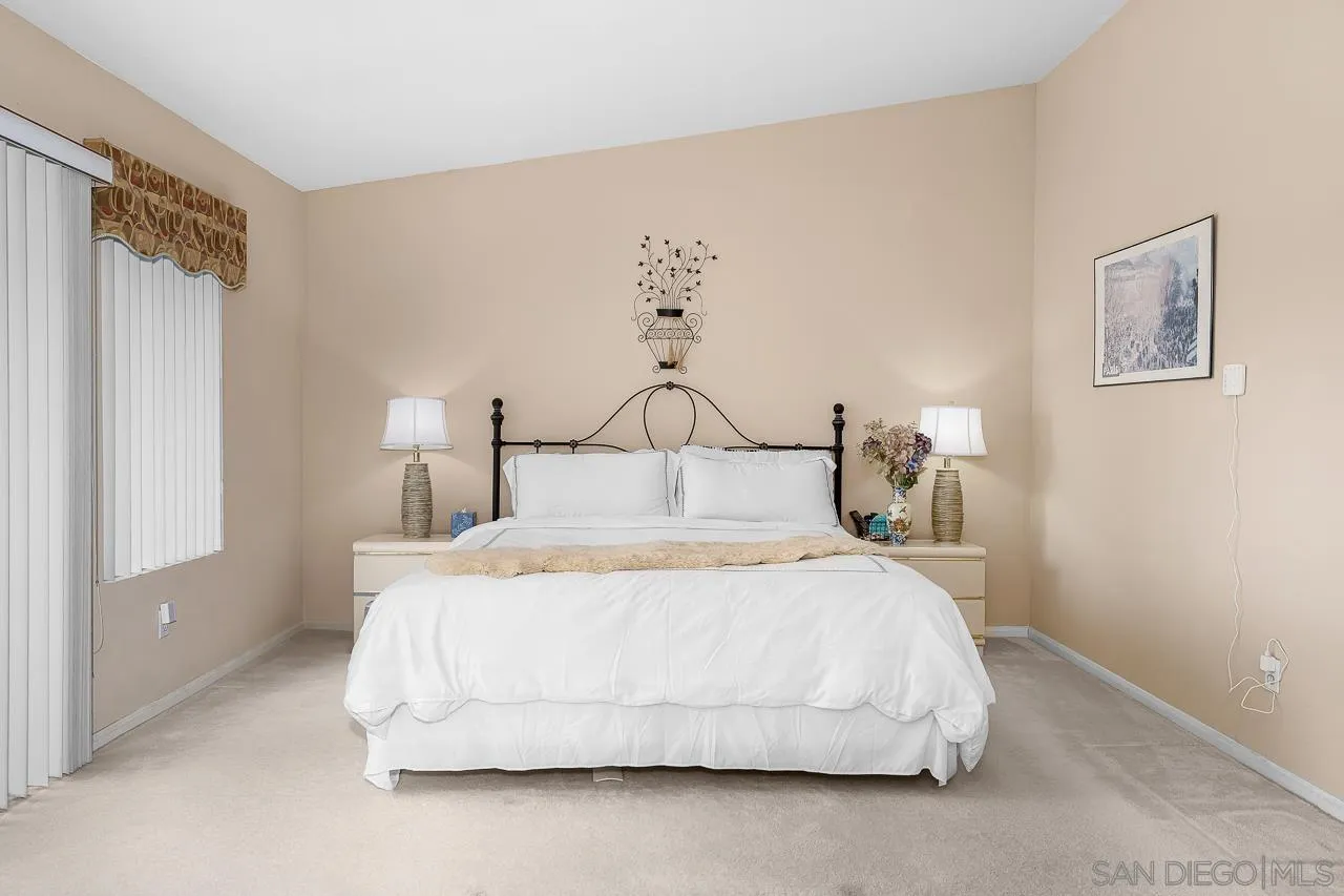 1559 Pleasanton Road Chula Vista, CA 91913 - Photo 17 of 41 a bedroom with a bed and lamp