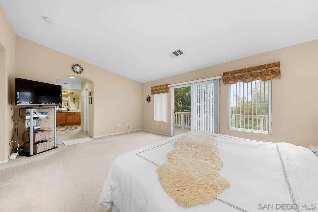 1559 Pleasanton Road Chula Vista, CA 91913 - Photo 19 of 41 a bedroom with a bed and a flat screen tv