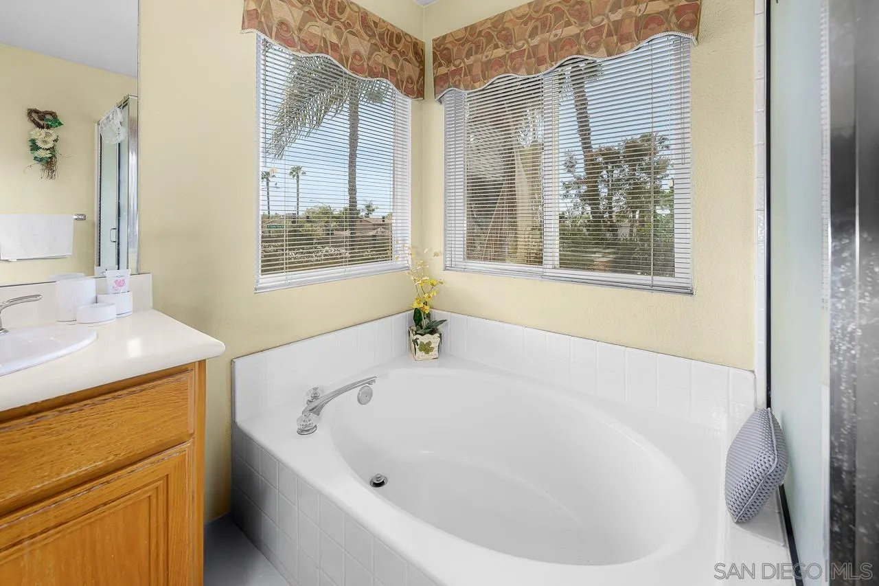 1559 Pleasanton Road Chula Vista, CA 91913 - Photo 24 of 41 a white bath tub sitting next to a white sink