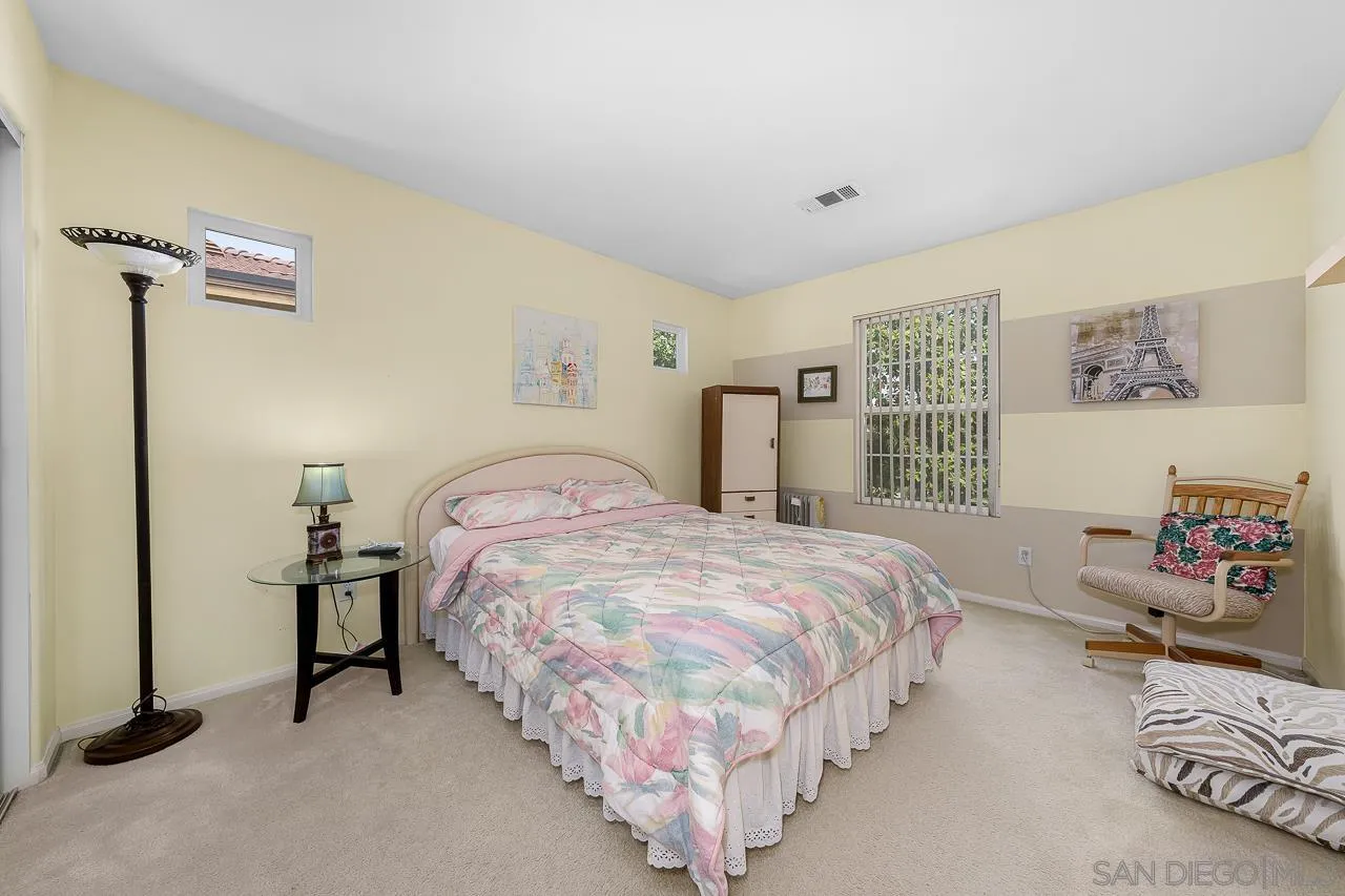 1559 Pleasanton Road Chula Vista, CA 91913 - Photo 27 of 41 a bedroom with a bed and a window