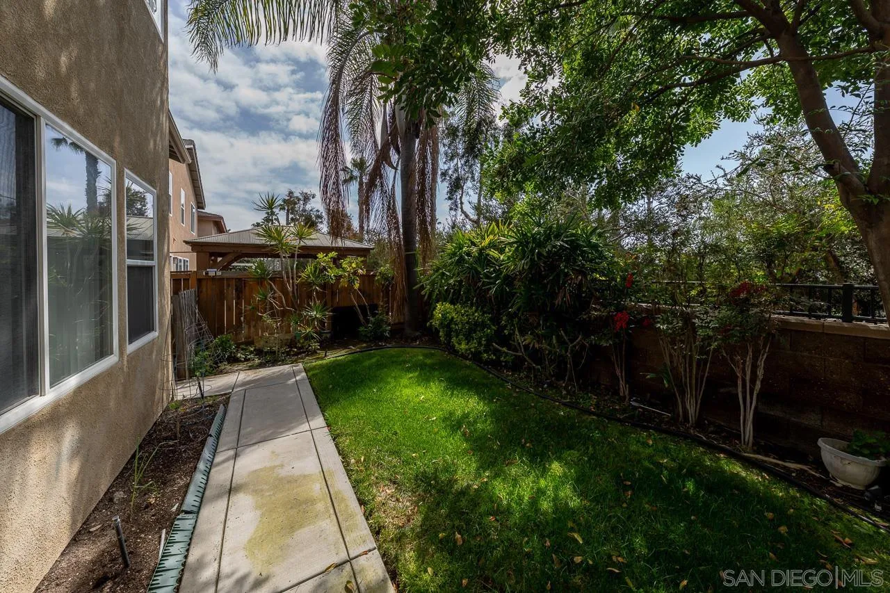 1559 Pleasanton Road Chula Vista, CA 91913 - Photo 38 of 41 a backyard of a house with lots of green space