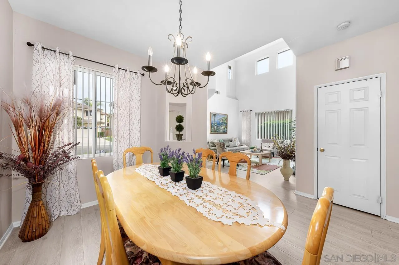 1559 Pleasanton Road Chula Vista, CA 91913 - Photo 5 of 41 a view of a dining room with furniture window and wooden floor