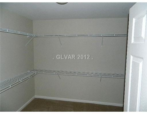 644 Tyler Ridge Avenue Henderson, NV 89012 - Photo 14 of 25 Master Bedroom. SPACIOUS WALK IN CLOSET IN THE MASTER SUITE