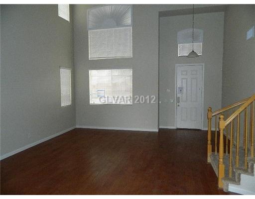 644 Tyler Ridge Avenue Henderson, NV 89012 - Photo 2 of 25 Living Room. LIVING ROOM WITH WELCOMING ENTRY FOYER