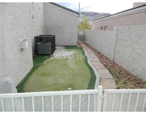 644 Tyler Ridge Avenue Henderson, NV 89012 - Photo 23 of 25 Other. YOUR OWN PUTTING GREEN! (LOOK AT THOSE MOUNTAINS IN THE BACKGROUND!!)