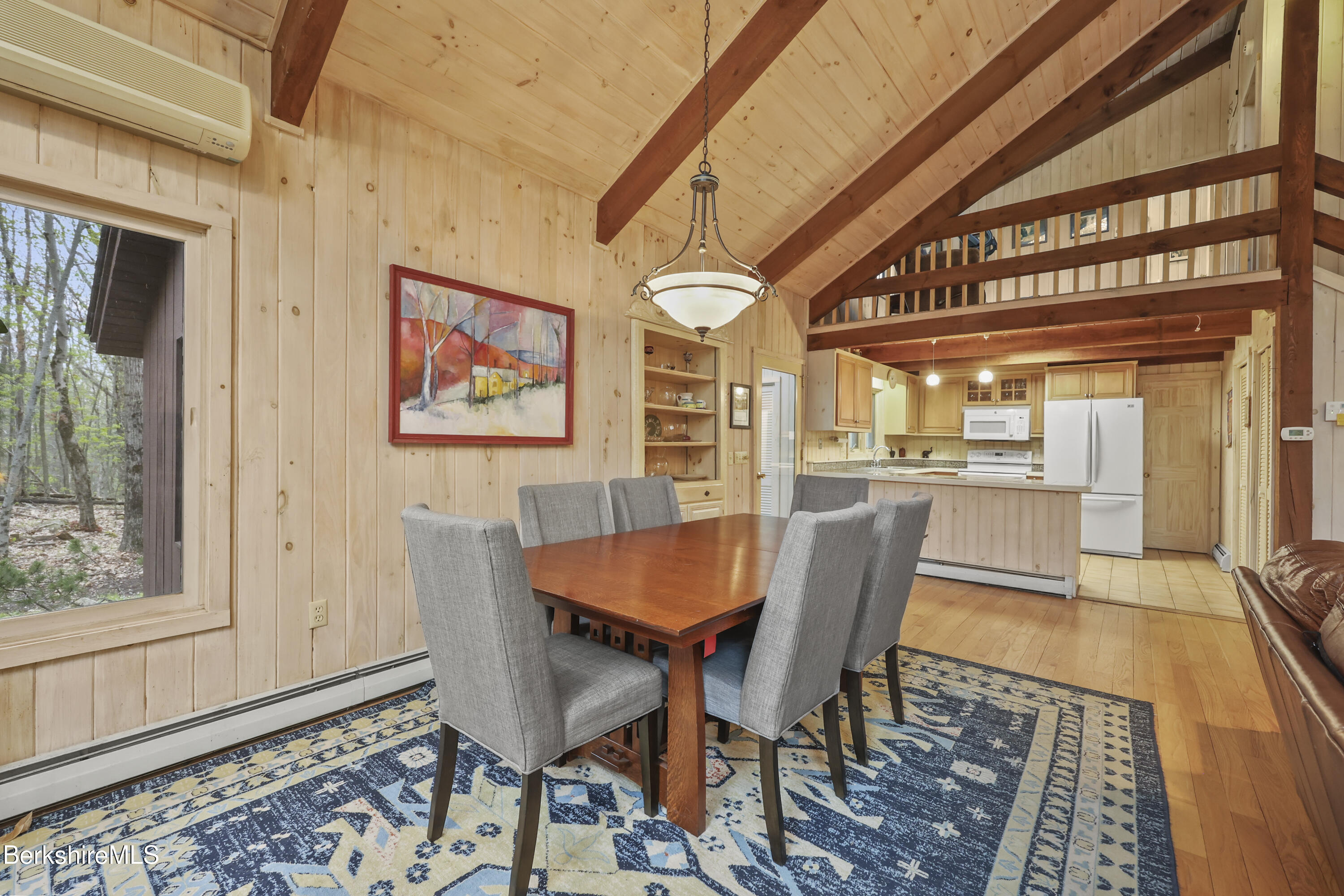 422 Bonny Rigg Hill Road Becket, MA 01223 - Photo 9 of 60 a dining room with wooden floor and a rug