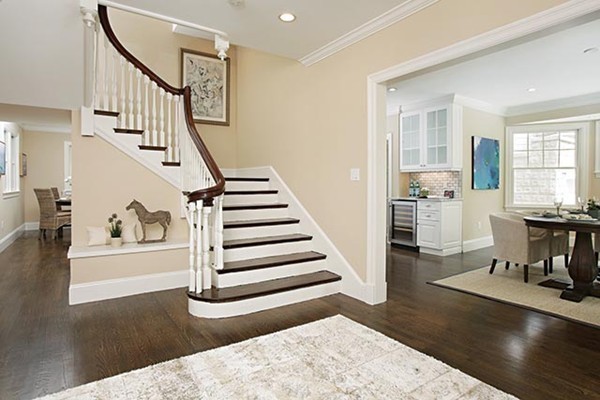 85 Dean Road Brookline, MA 02445 - Photo 3 of 12 a view of entryway and hall with wooden floor