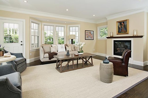 85 Dean Road Brookline, MA 02445 - Photo 4 of 12 a living room with furniture and a fireplace