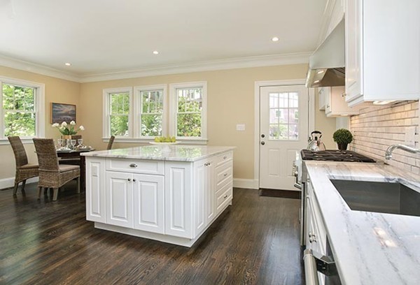85 Dean Road Brookline, MA 02445 - Photo 7 of 12 a kitchen with a sink stove and wooden cabinets