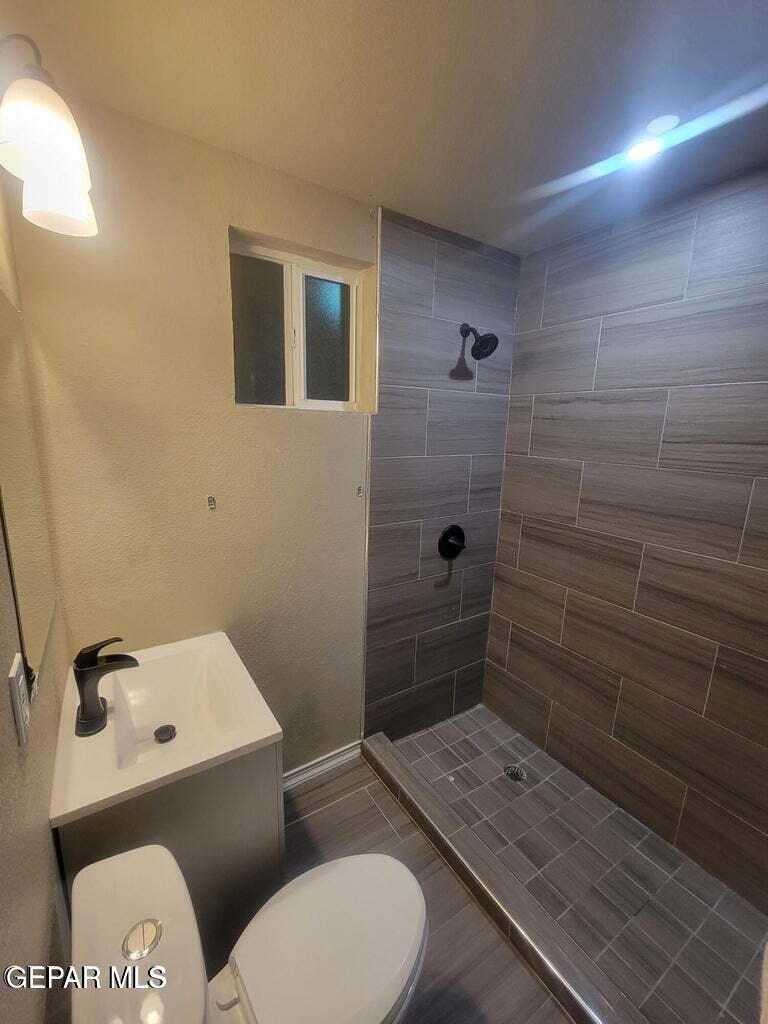 11531 Ernest Road, Unit 13 Socorro, TX 79927 - Photo 10 of 36 a bathroom with a toilet and a shower