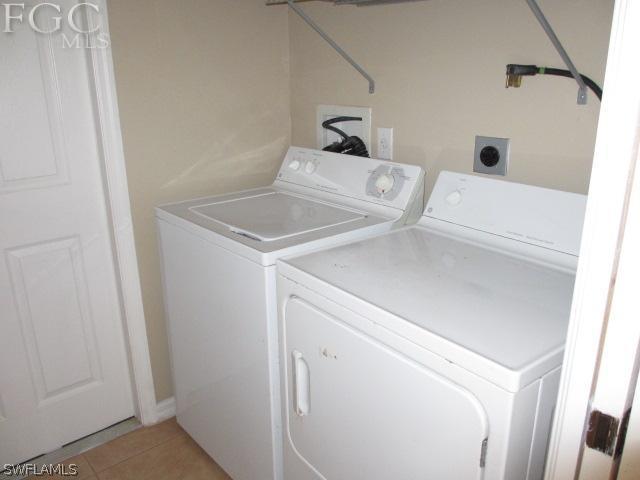 17421 Lee Road Fort Myers, FL 33967 - Photo 12 of 13 a utility room with dryer and washer