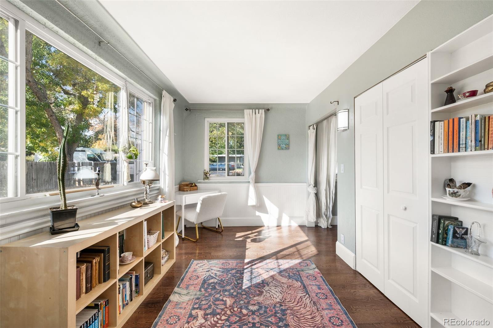 4730 Otis Street Wheat Ridge, CO 80033 - Photo 11 of 34 a living room with large window and a table