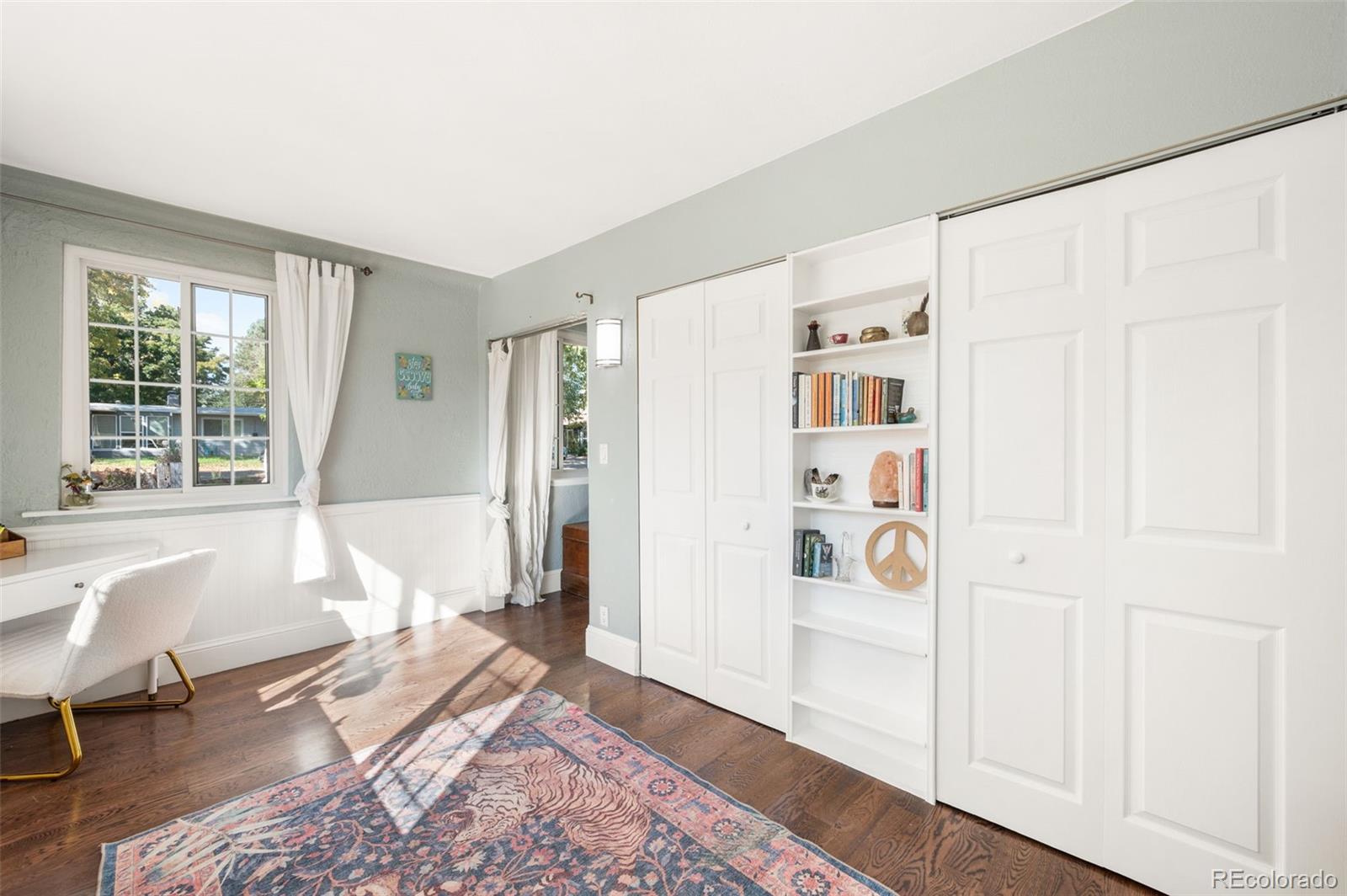 4730 Otis Street Wheat Ridge, CO 80033 - Photo 12 of 34 a spacious bedroom with a bed and a window