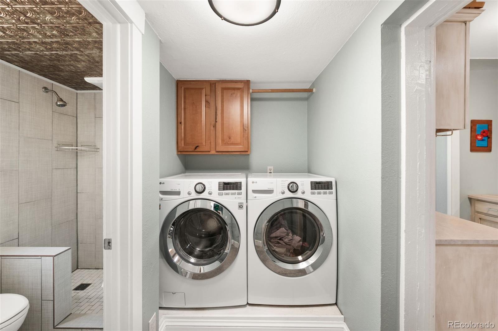 4730 Otis Street Wheat Ridge, CO 80033 - Photo 16 of 34 a utility room with dryer and washer