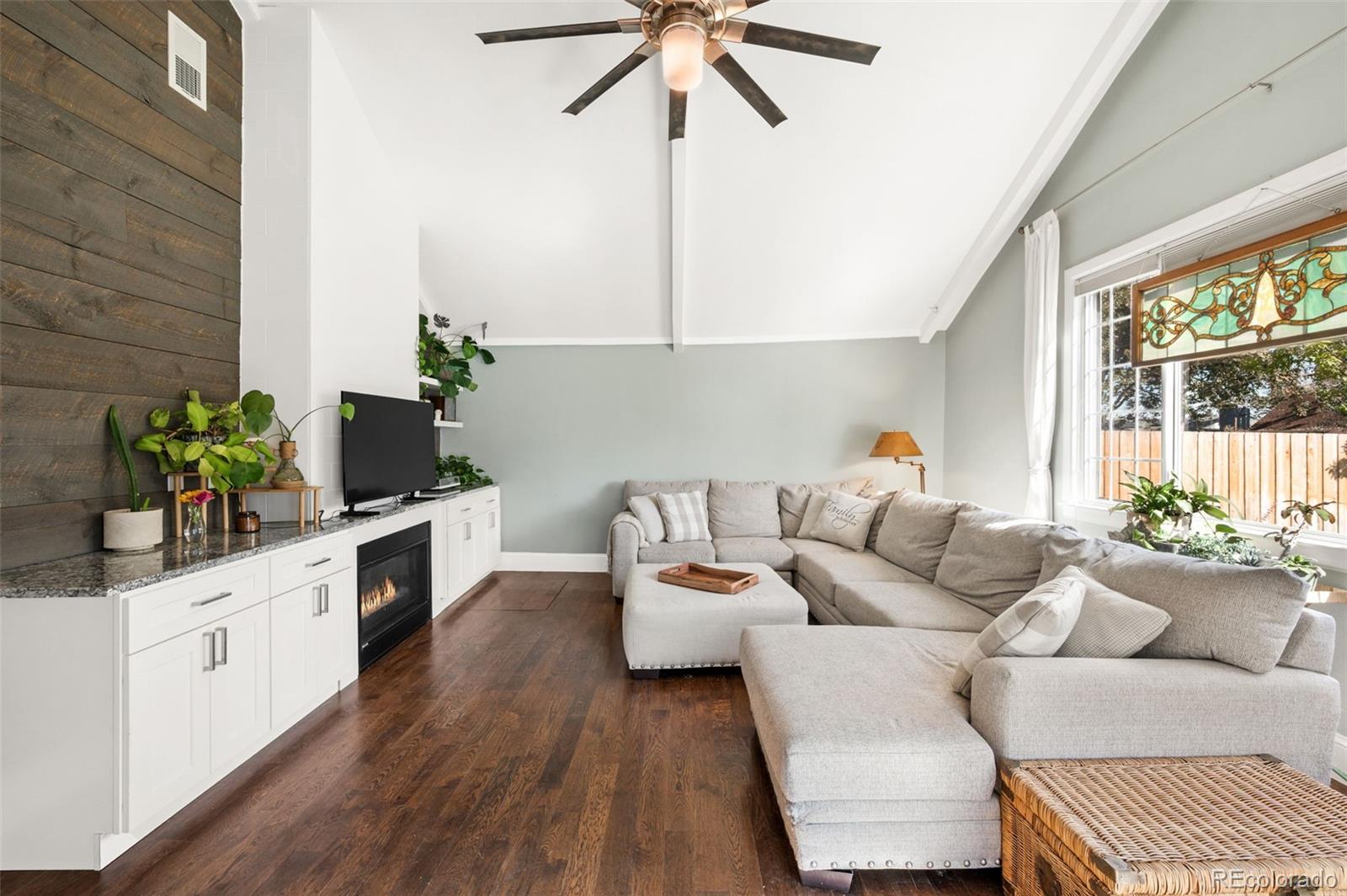 4730 Otis Street Wheat Ridge, CO 80033 - Photo 4 of 34 a living room with furniture and a potted plant