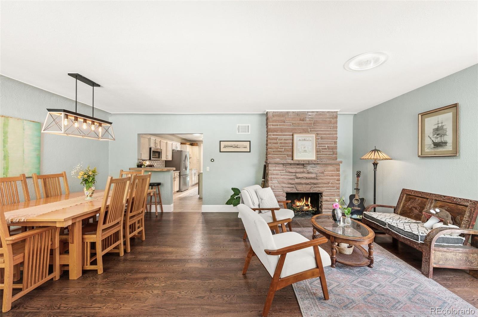 4730 Otis Street Wheat Ridge, CO 80033 - Photo 8 of 34 a living room with furniture and a fireplace