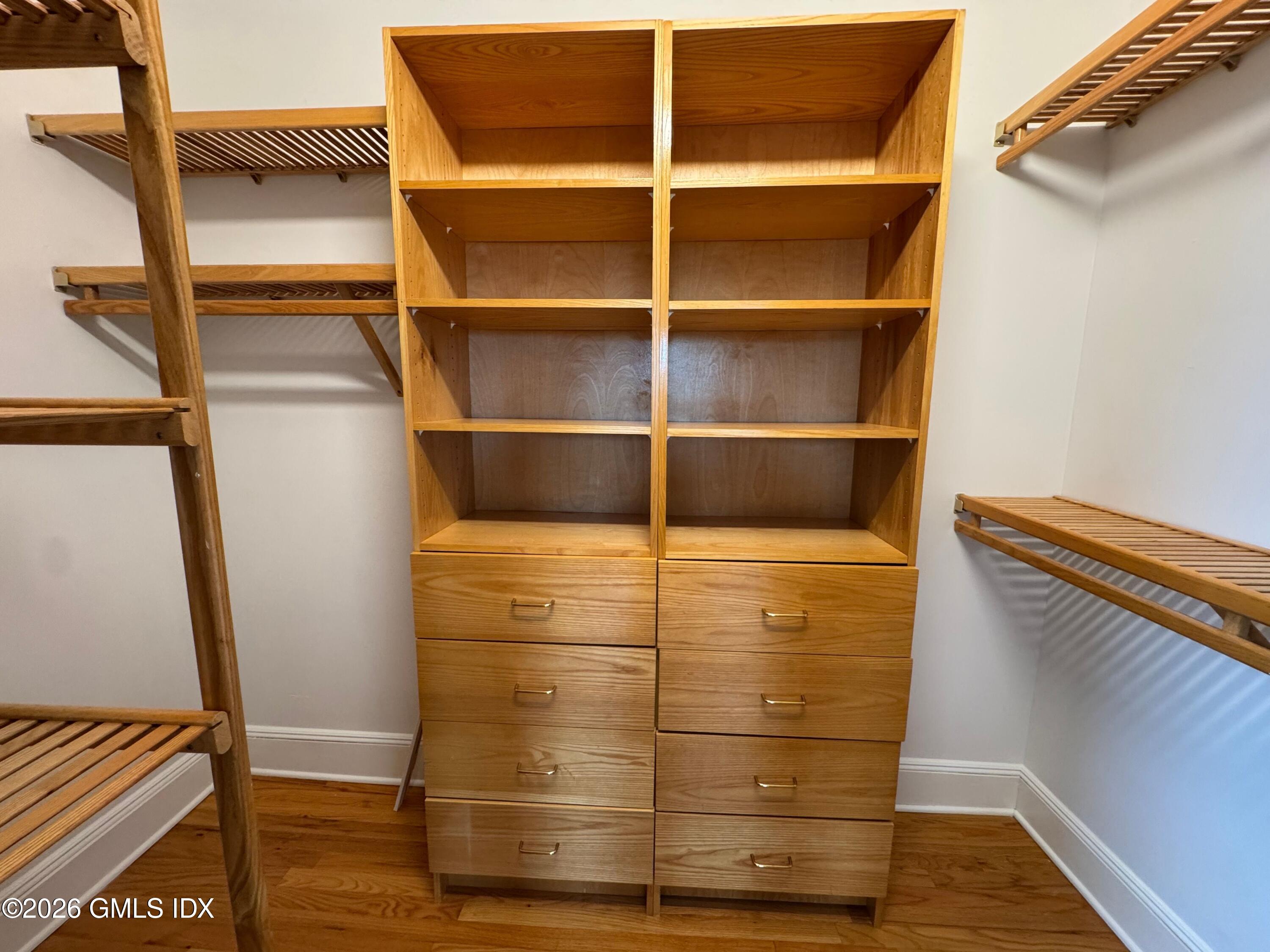 25 West Elm Street, Unit 40 Greenwich, CT 06830 - Photo 17 of 28 a view of walk in closet with empty racks