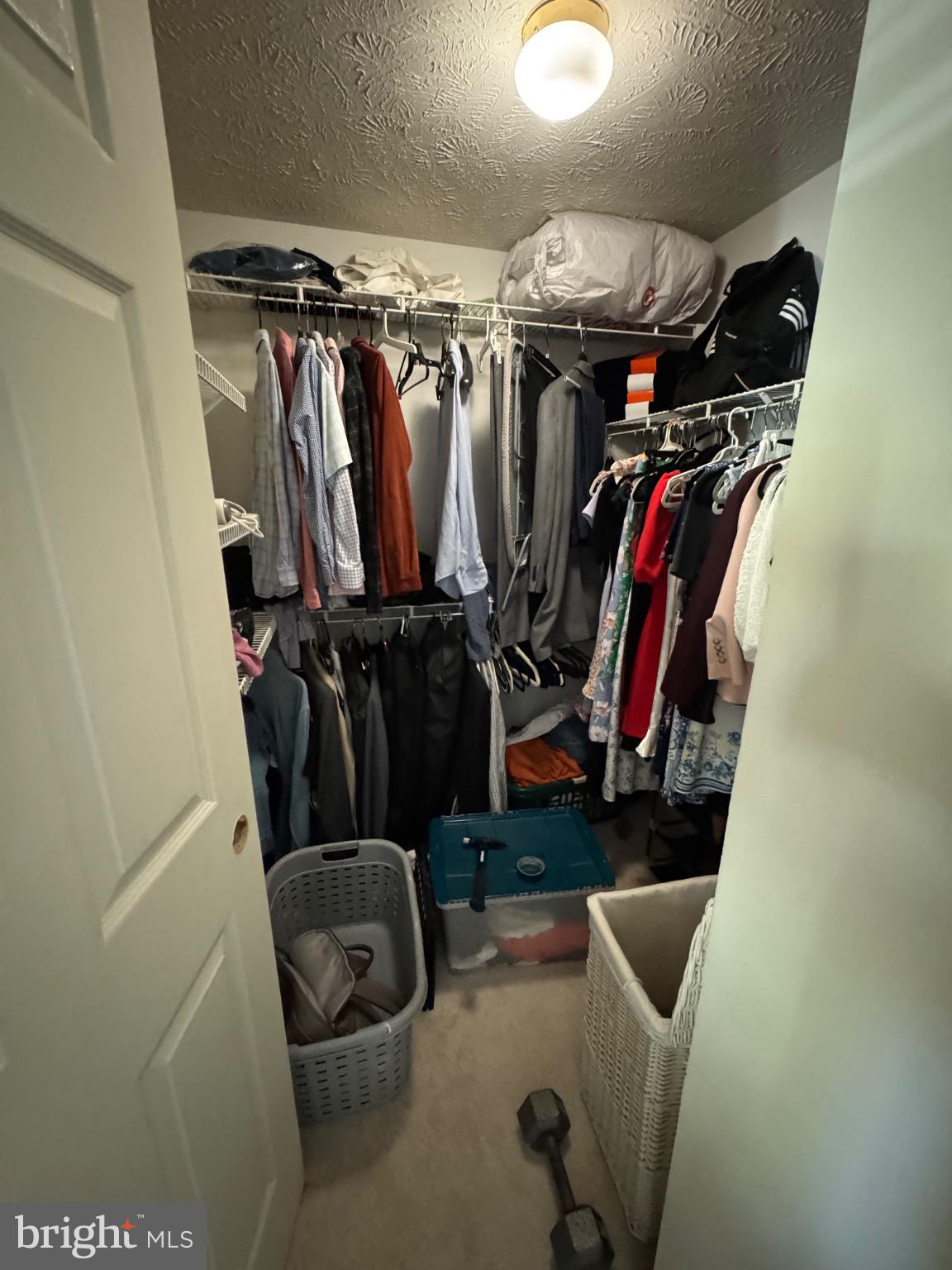 1565 Autumn Ridge Circle Reston, VA 20194 - Photo 11 of 19 a view of walk in closet with clothes
