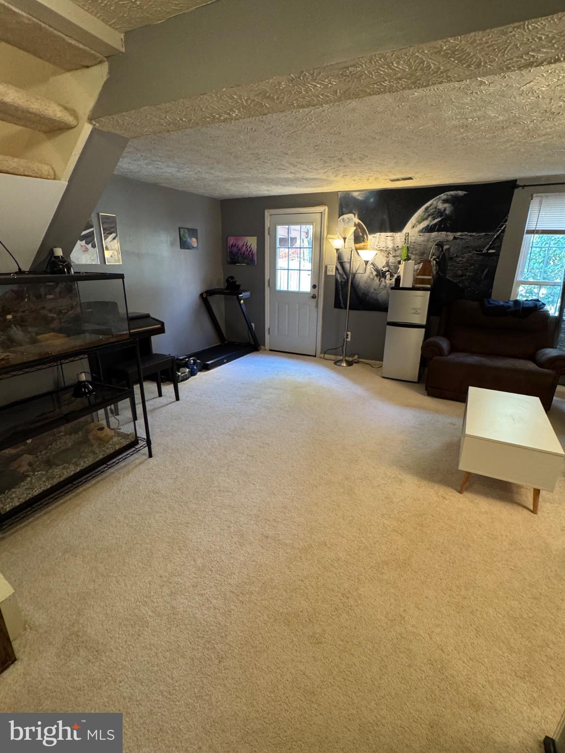 1565 Autumn Ridge Circle Reston, VA 20194 - Photo 16 of 19 a living room with furniture and a piano