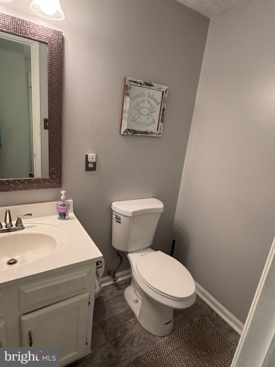 1565 Autumn Ridge Circle Reston, VA 20194 - Photo 4 of 19 a white toilet sitting next to a bathroom sink