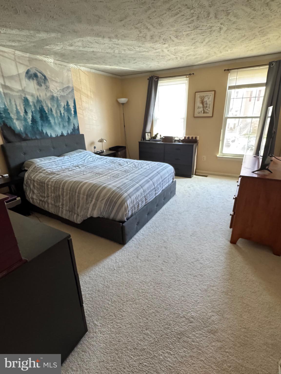 1565 Autumn Ridge Circle Reston, VA 20194 - Photo 9 of 19 a bedroom with a bed and wooden floor