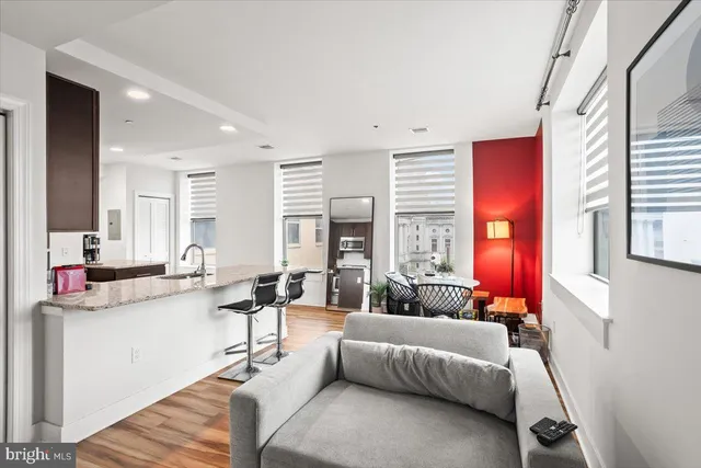 a living room with furniture and a large window