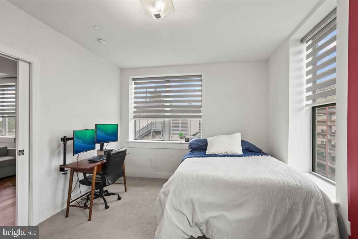 231 State Street, Unit 805 Harrisburg, PA 17101 - Photo 21 of 37 a bedroom with a bed and a window