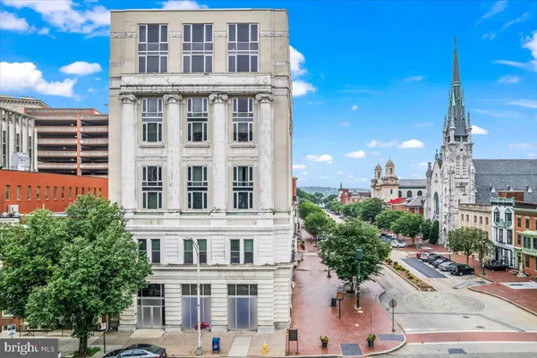 a view of a building with a yard
