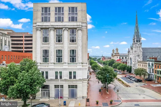 a view of a building with a yard