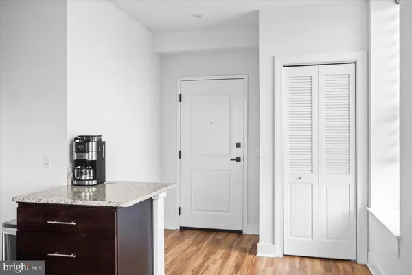 a view of kitchen with wooden floor