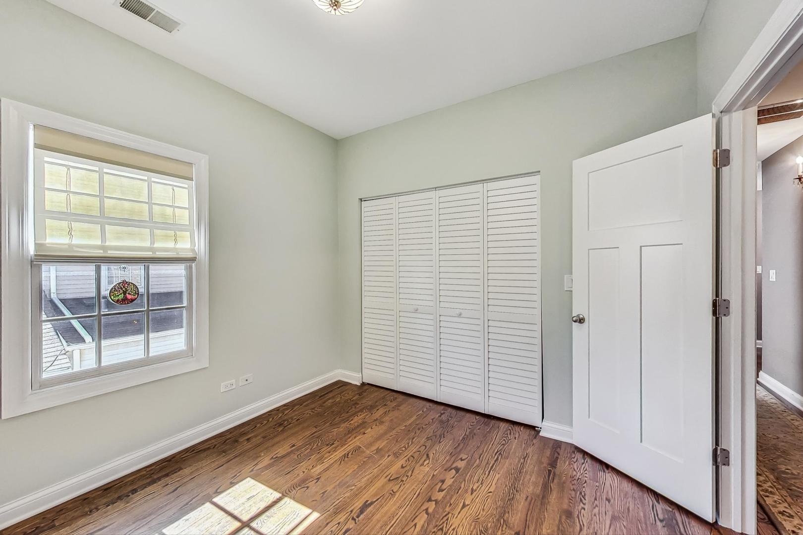 1526 West Talcott Road Park Ridge, IL 60068 - Photo 12 of 24 wooden floor in an empty room with a window