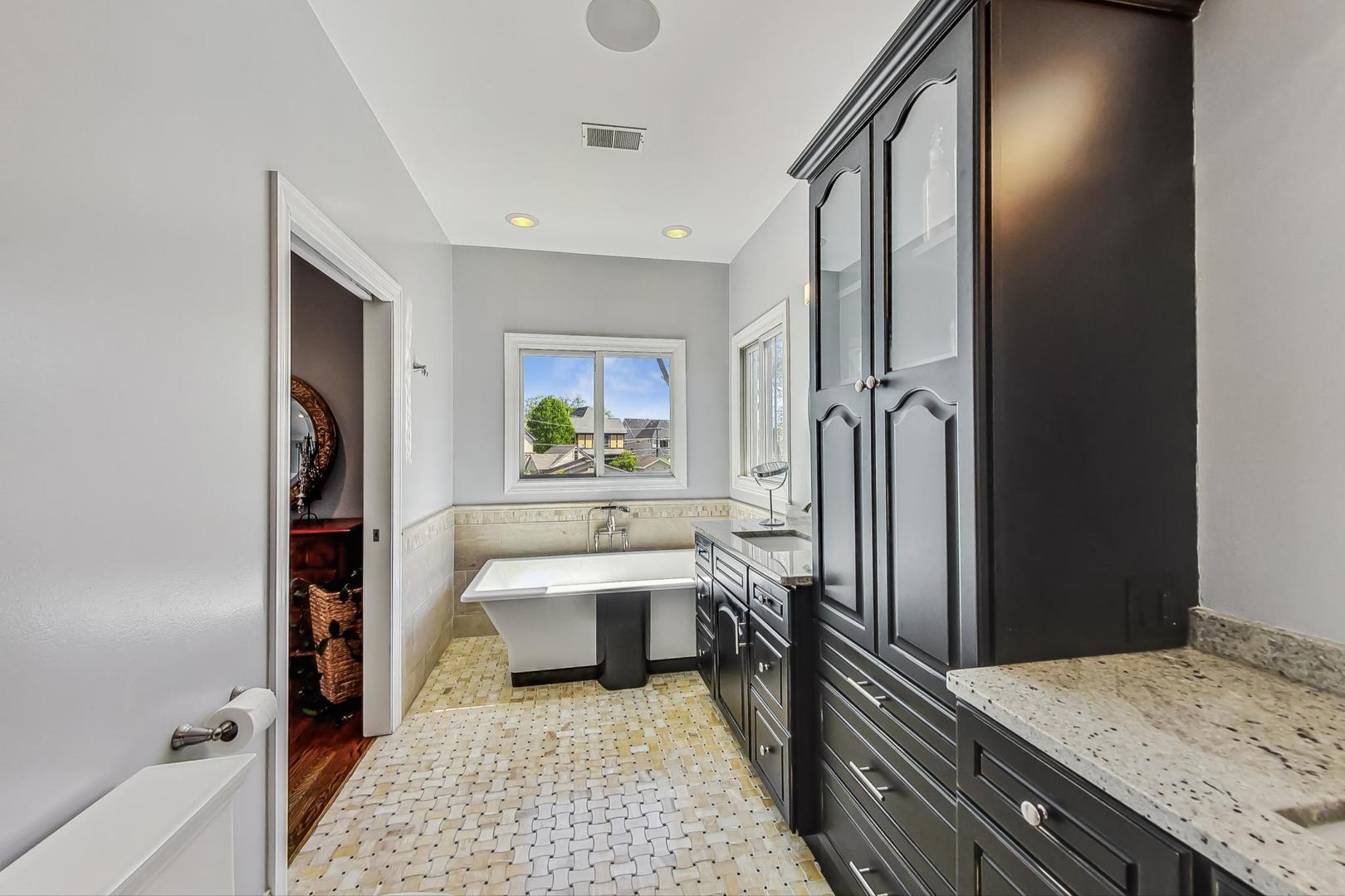 1526 West Talcott Road Park Ridge, IL 60068 - Photo 15 of 24 a bedroom with a bed and a dresser next to a window