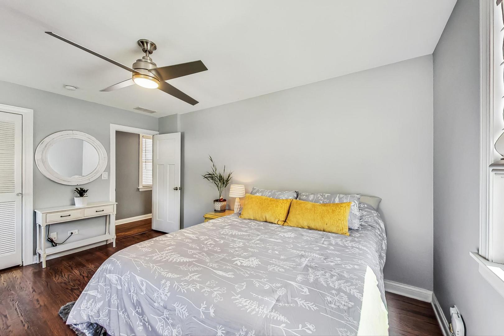 1526 West Talcott Road Park Ridge, IL 60068 - Photo 9 of 24 a bedroom with a bed and a chandelier