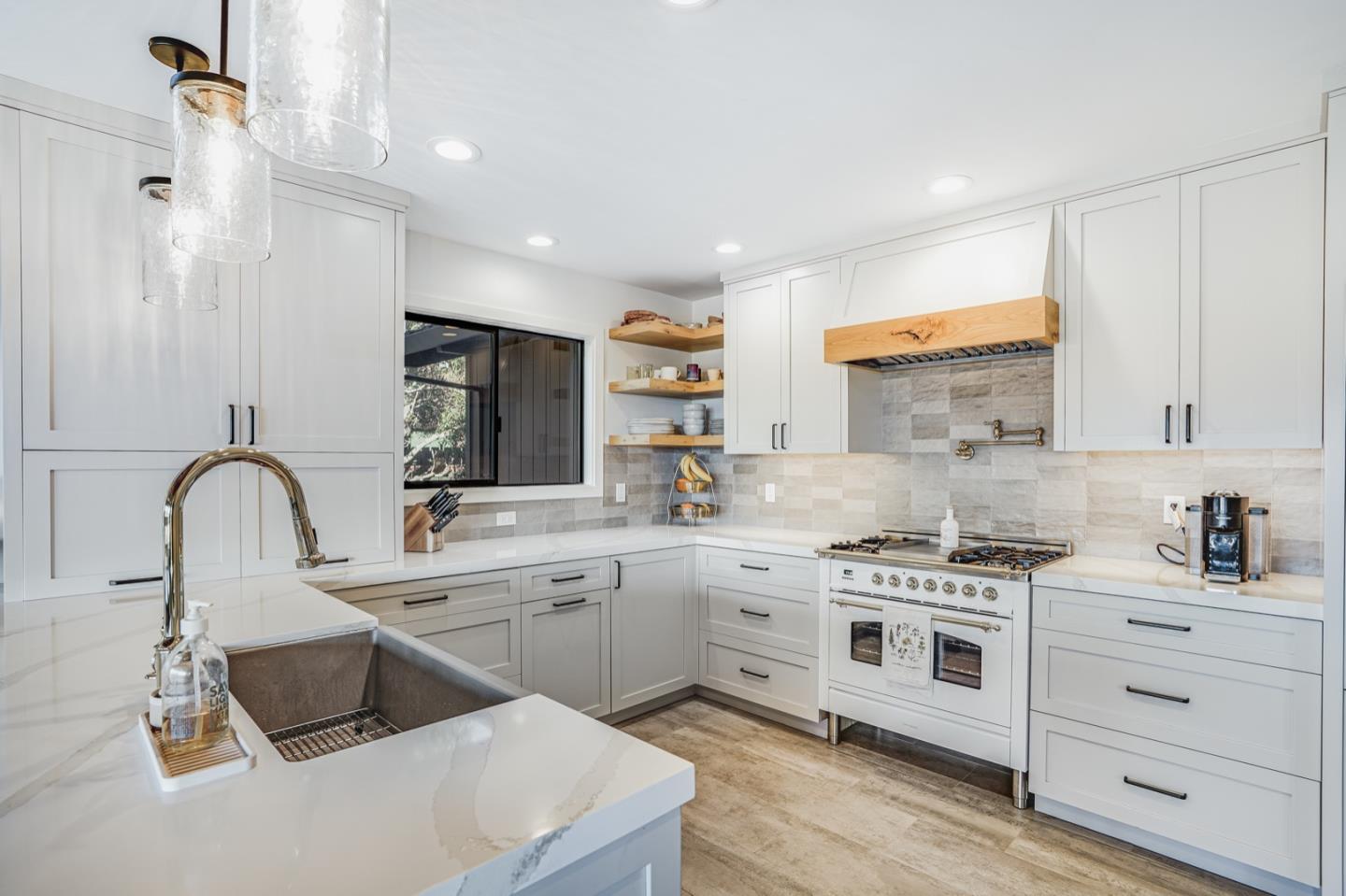 14150 Reservation Road Salinas, CA 93908 - Photo 11 of 47 a kitchen with a sink stove and cabinets