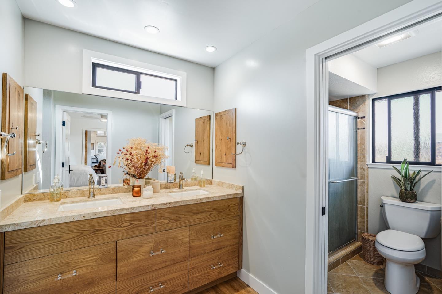 14150 Reservation Road Salinas, CA 93908 - Photo 20 of 47 a bathroom with a toilet sink and mirror